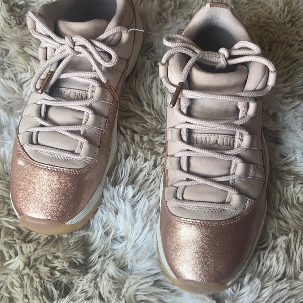 Authentic women’s Air Jordan 11 retro low rose gold sneakers